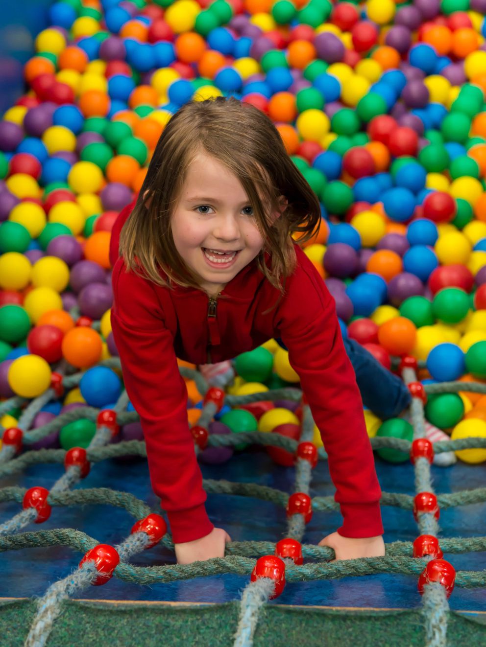 Girl in ball pit